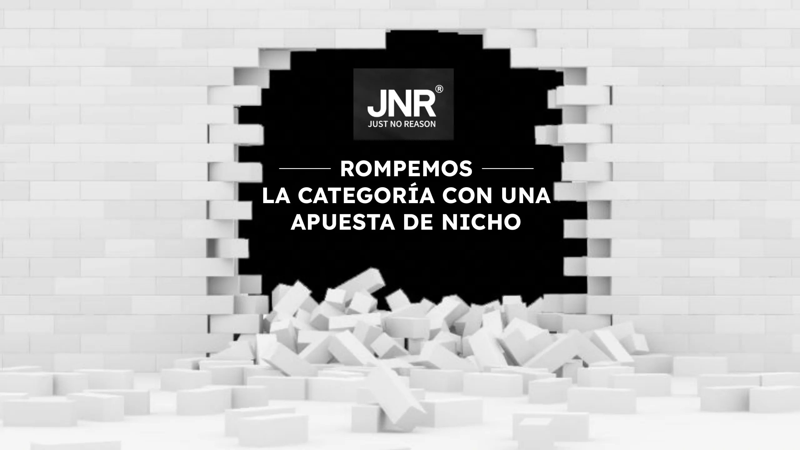 Lámina Rompemos la categoría con una apuesta de nicho, con el logo de JNR atravesando una pared