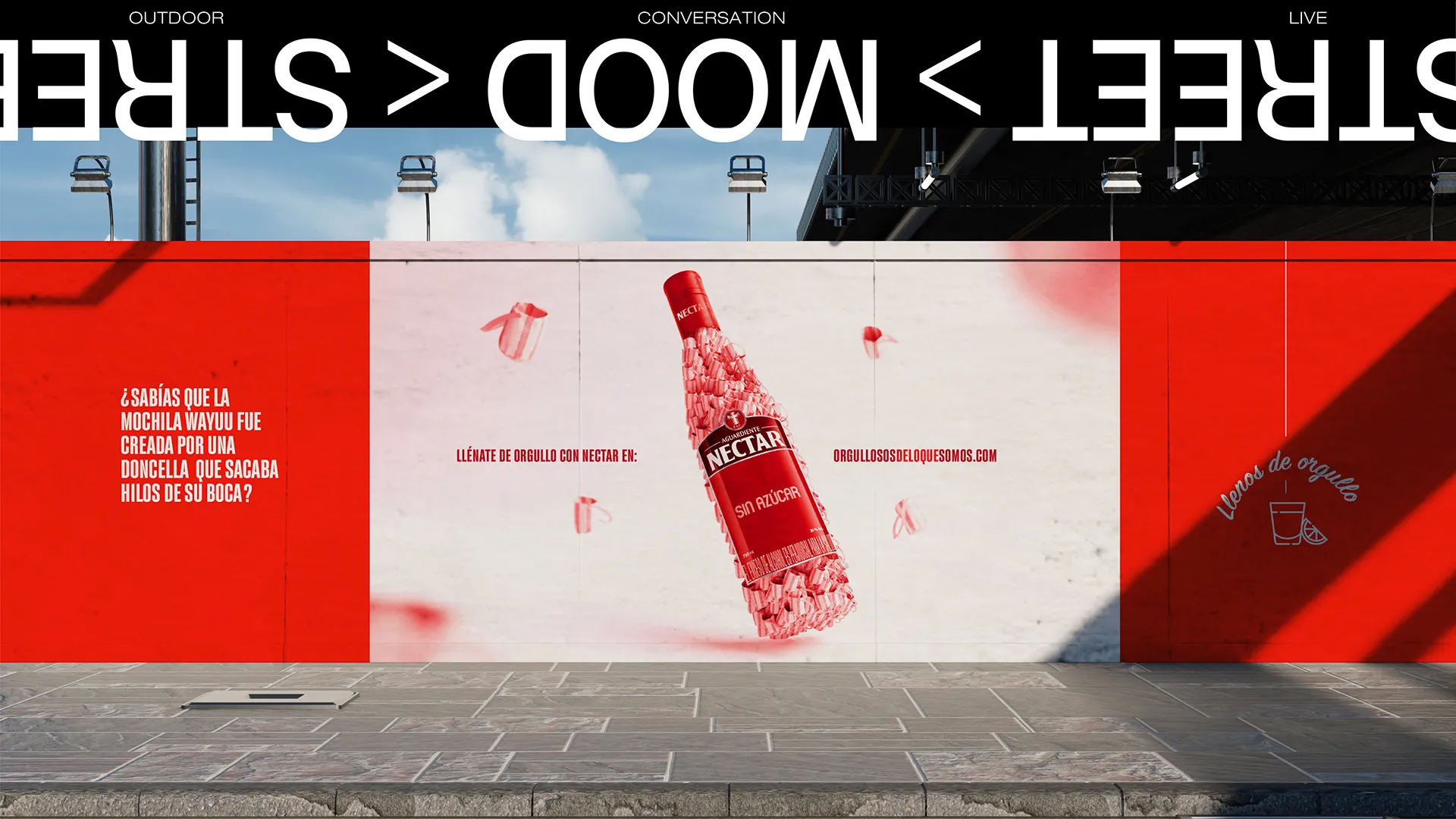 Muro en la calle con la botella roja de Néctar y su mensaje